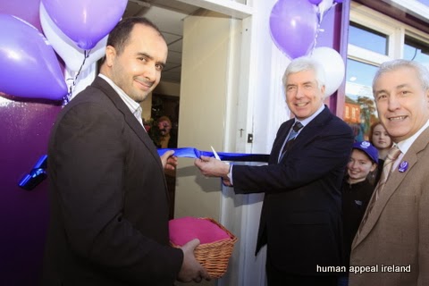 Belkacem Belfedhal, Alex White and Ammar Ouamar cutting the ribbon at the Human Appeal Ireland Charity Shop in Dundrum.